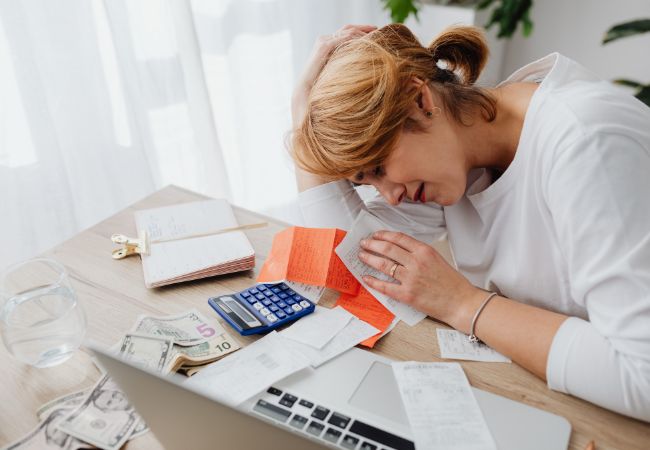 Baltimore resident reviewing a debt forgiveness letter after settling a credit card balance